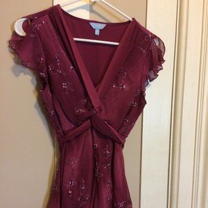 Denver Hayes, short sleeved, burgundy top with embroidered flower details